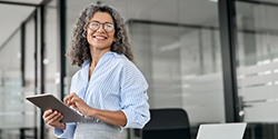 a business woman smiling while at the office